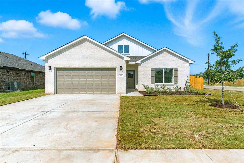 421 Jameson Springtown, TX 76082 - Photo 35 of 37 a front view of a house with garden
