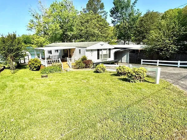 a view of a house with pool table and chairs