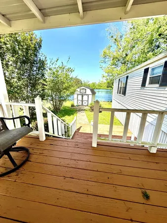 a view of a balcony with chairs