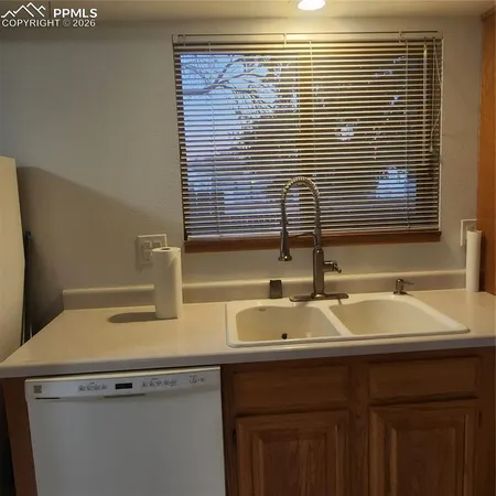 a bathroom with a sink and a window
