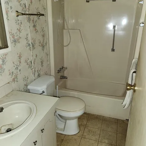 an empty room with a empty space and windows