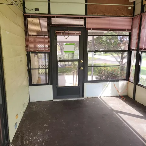 a view of swimming pool with outdoor seating and city view
