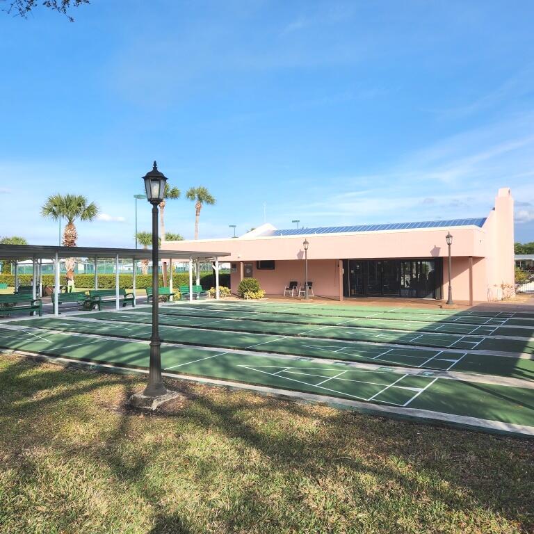 2847 Southwest Thunderbird Trail Stuart, FL 34997 - Photo 22 of 22 a view of a big house in a big yard with large trees