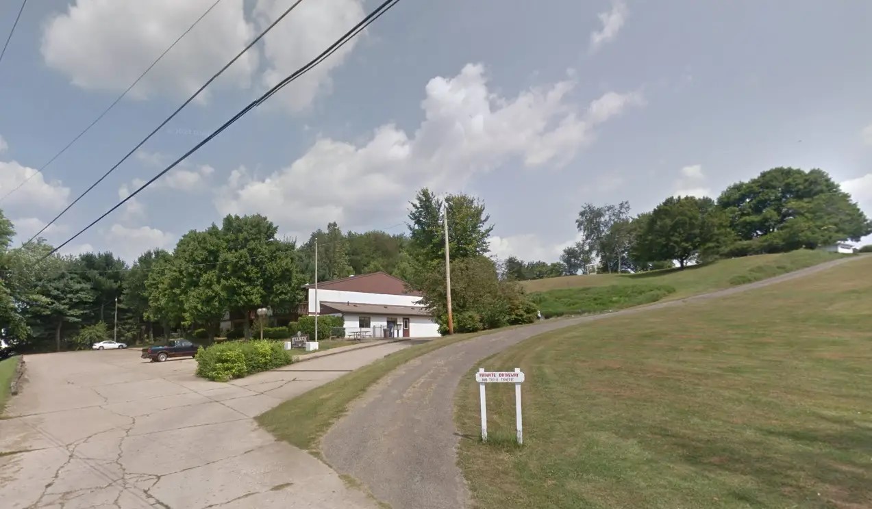 132 Mullet Drive Killbuck, OH 44637 - Photo 2 of 6 a view of a bench in a backyard of house