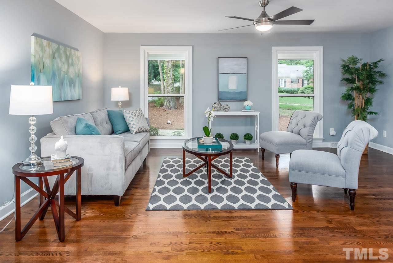 4008 Oak Park Road Raleigh, NC 27612 - Photo 2 of 24 a living room with furniture and a large window