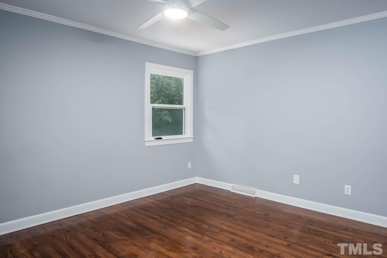 4008 Oak Park Road Raleigh, NC 27612 - Photo 12 of 24 wooden floor in an empty room with a window