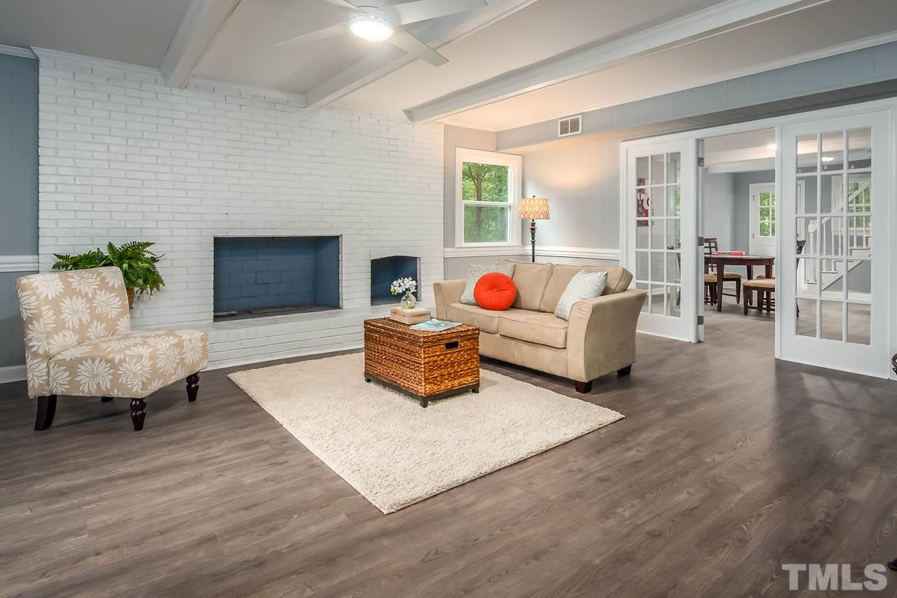 4008 Oak Park Road Raleigh, NC 27612 - Photo 14 of 24 a living room with furniture and a fireplace