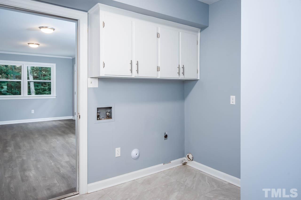 4008 Oak Park Road Raleigh, NC 27612 - Photo 17 of 24 a view of an empty room with a window