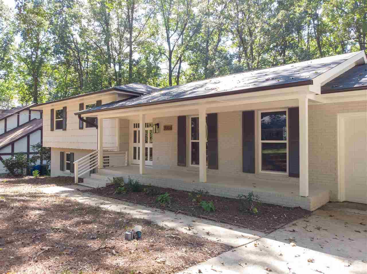 4008 Oak Park Road Raleigh, NC 27612 - Photo 22 of 24 a front view of a house with a yard