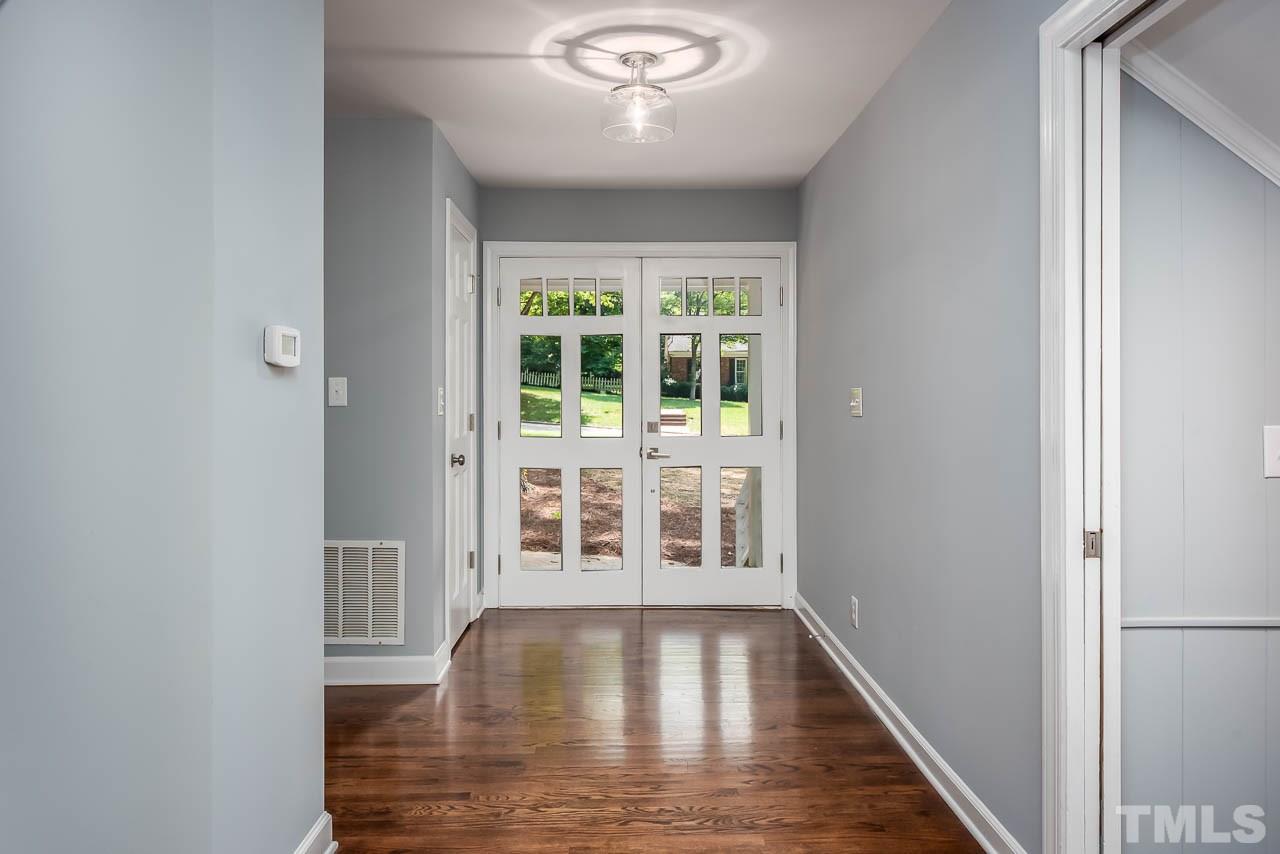 4008 Oak Park Road Raleigh, NC 27612 - Photo 23 of 24 wooden floor in an empty room with a window