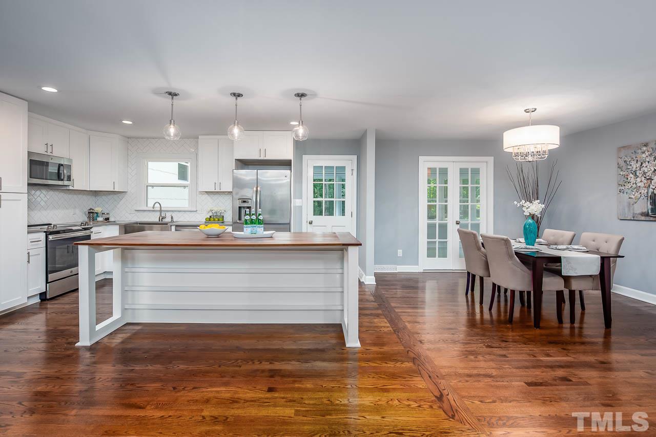 4008 Oak Park Road Raleigh, NC 27612 - Photo 24 of 24 a view of kitchen with dining table and chairs