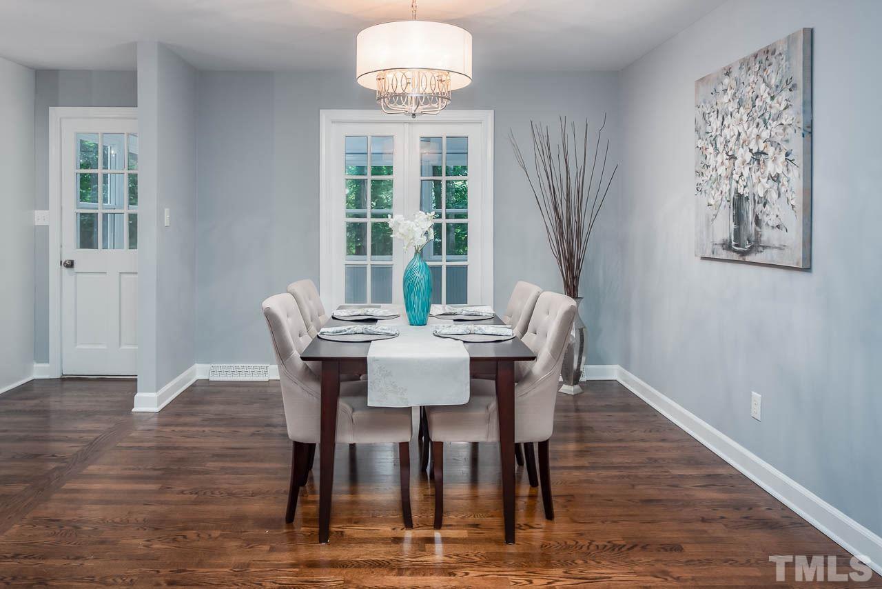 4008 Oak Park Road Raleigh, NC 27612 - Photo 5 of 24 a view of a dining room with furniture window and wooden floor