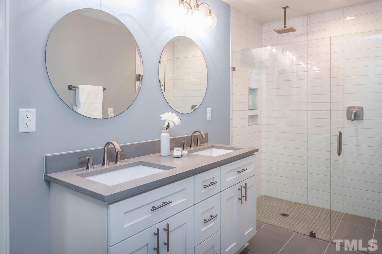 4008 Oak Park Road Raleigh, NC 27612 - Photo 8 of 24 a bathroom with a sink and a mirror