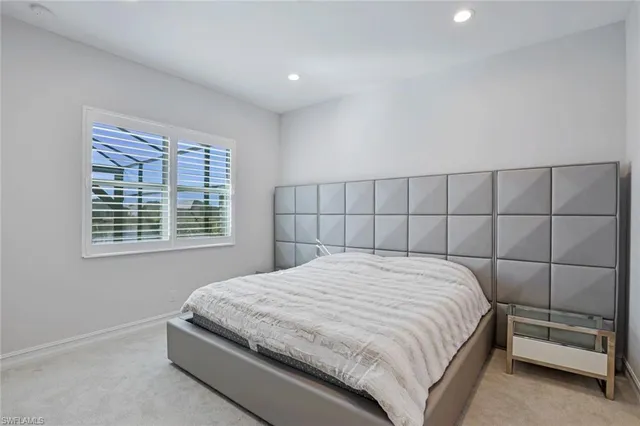 a bathroom with a sink vanity granite toilet and a mirror