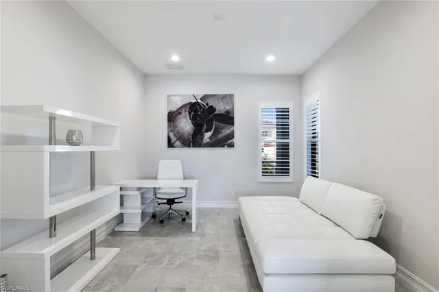a living room with a couch and a table