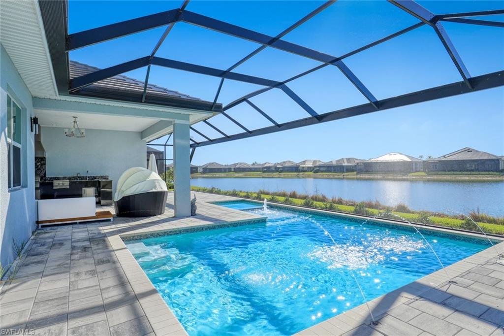 14327 Laguna Springs Lane Naples, FL 34114 - Photo 26 of 35 a view of a living room and floor to ceiling window