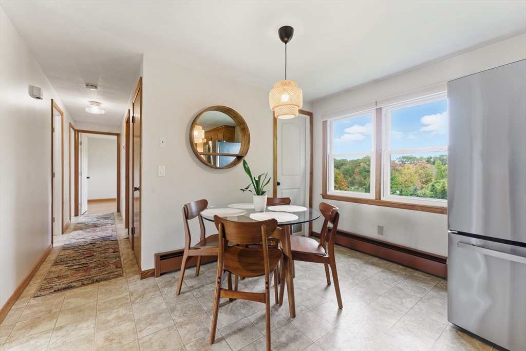 97 Mountain Road Holyoke, MA 01040 - Photo 11 of 27 a view of a dining room with furniture window and wooden floor