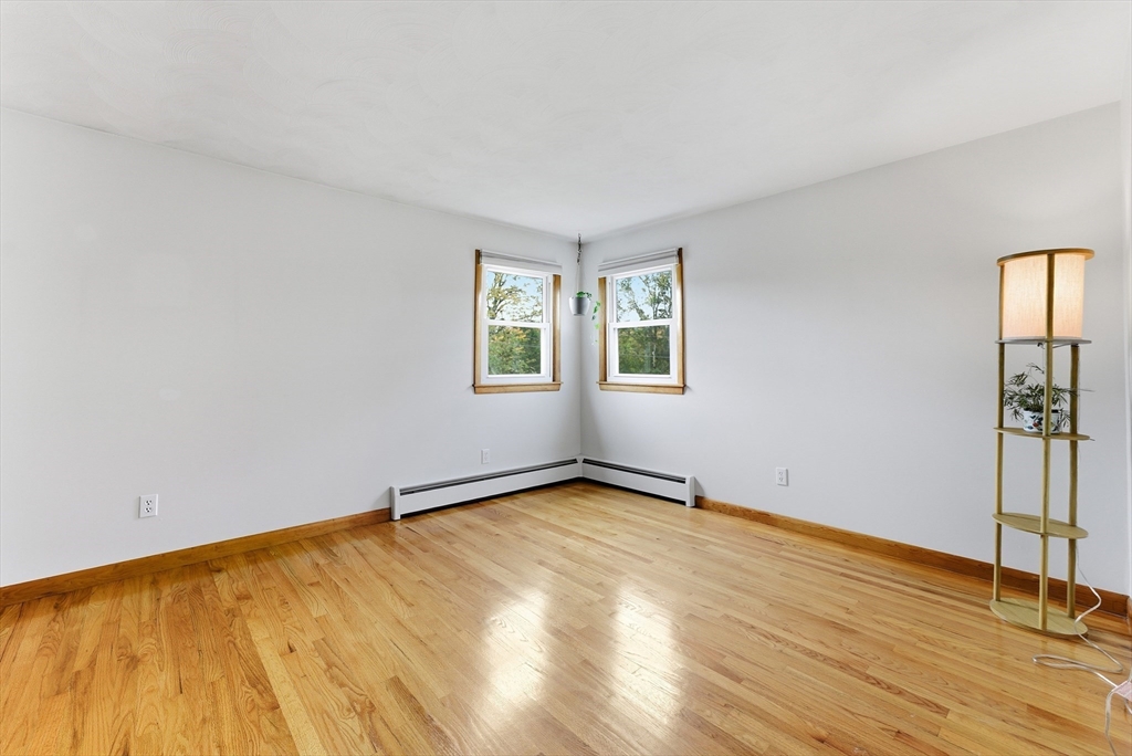 97 Mountain Road Holyoke, MA 01040 - Photo 14 of 27 a view of an empty room with wooden floor and a window