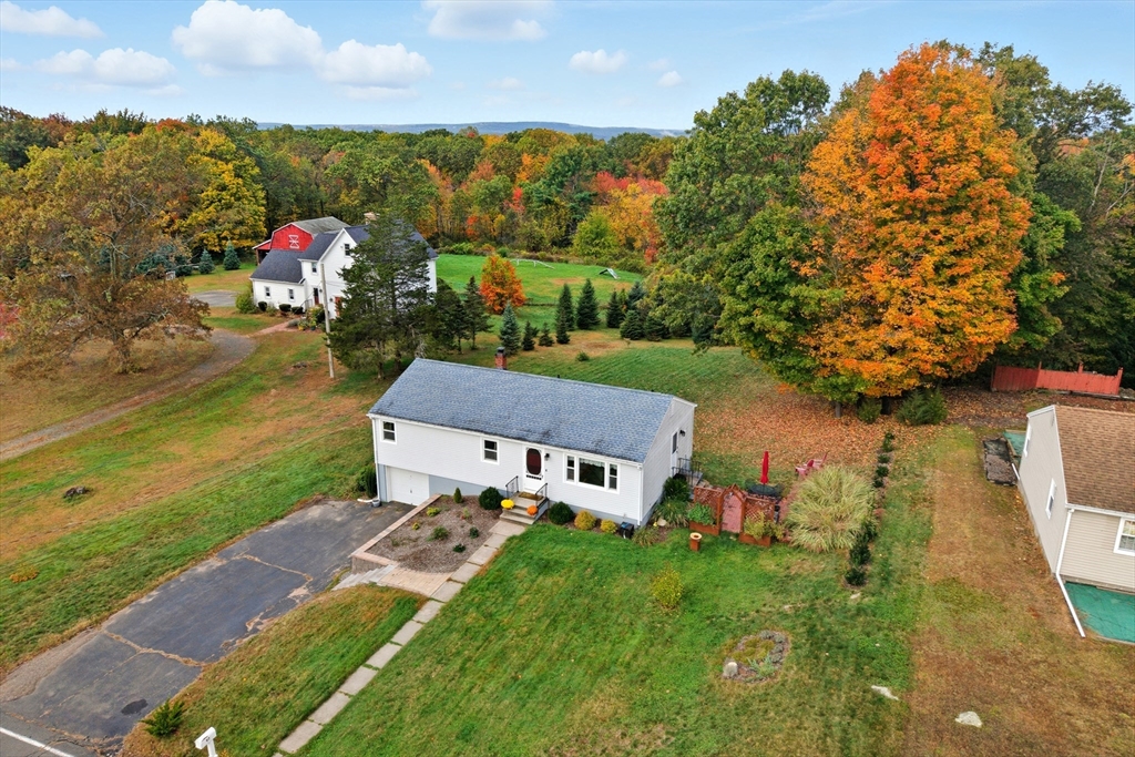 97 Mountain Road Holyoke, MA 01040 - Photo 2 of 27 an aerial view of a house with a garden