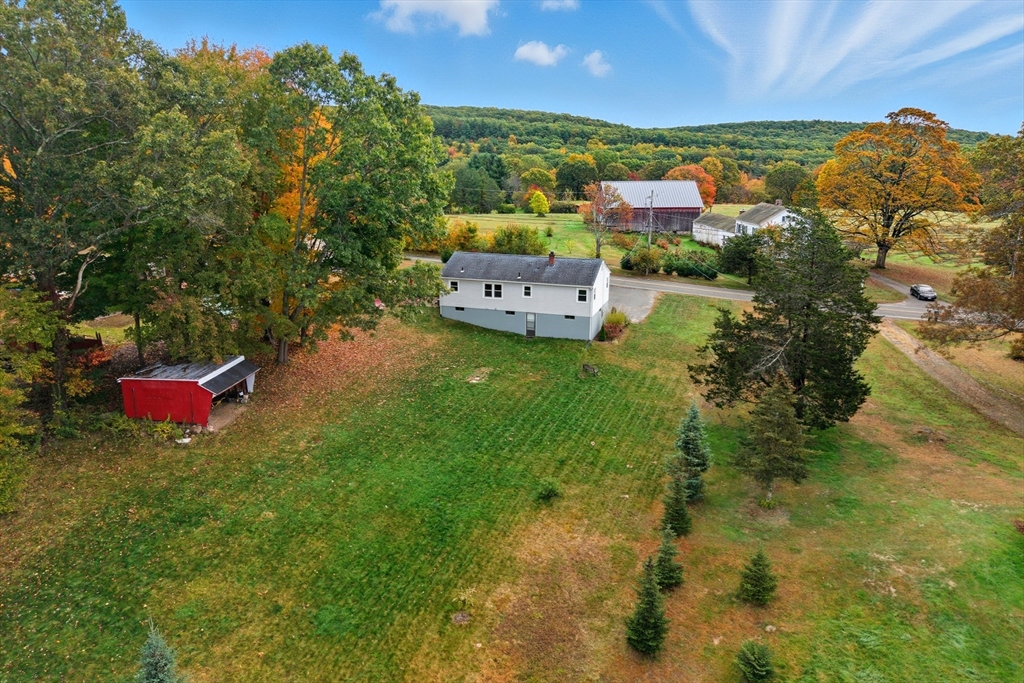 97 Mountain Road Holyoke, MA 01040 - Photo 3 of 27 a backyard of a house with yard and outdoor seating