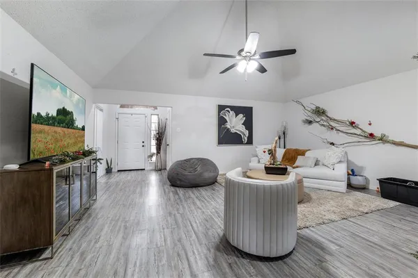 a living room with furniture and a flat screen tv