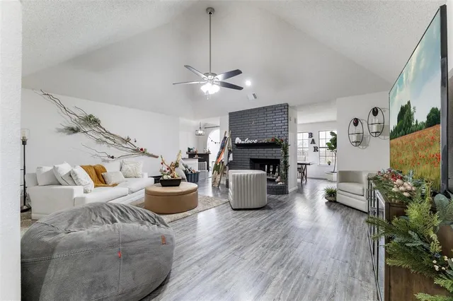 a living room with furniture fireplace and flat screen tv