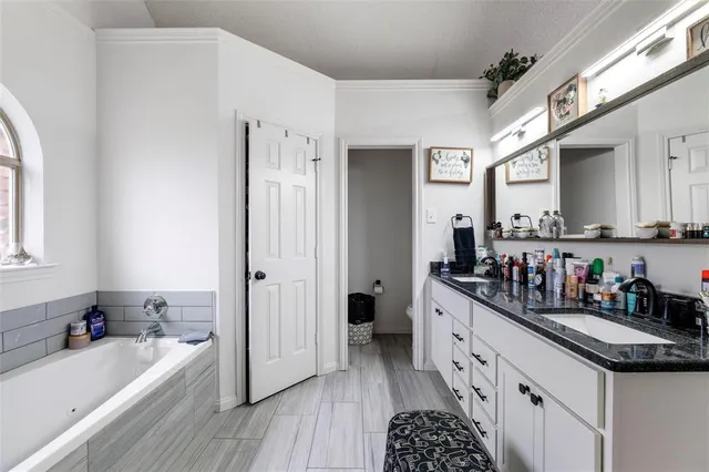 a kitchen with stainless steel appliances a sink stove and cabinets