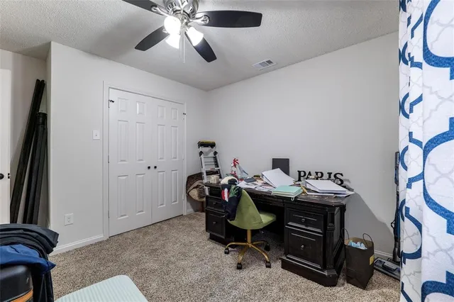 a view of a workspace with furniture