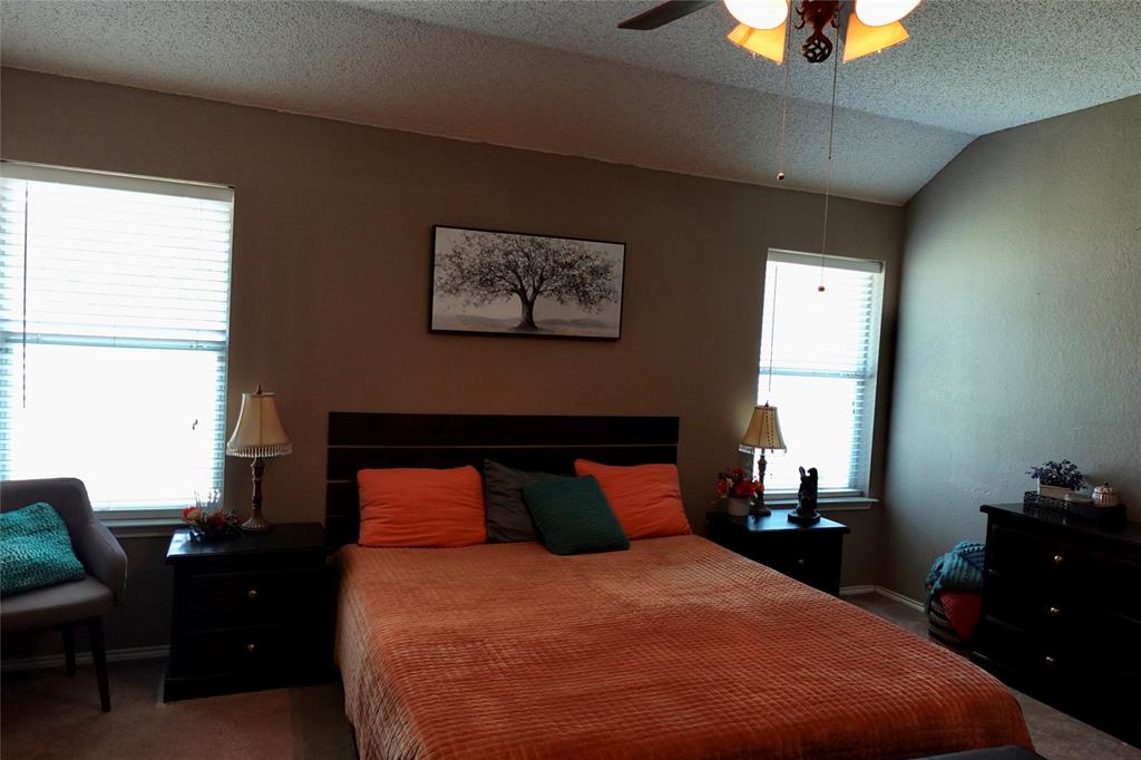 173 West Ranch Lane Weatherford, TX 76088 - Photo 11 of 29 a bedroom with a bed and wooden floor