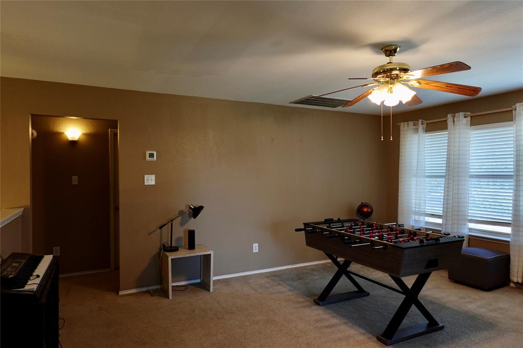 173 West Ranch Lane Weatherford, TX 76088 - Photo 16 of 29 a living room with furniture and a chandelier