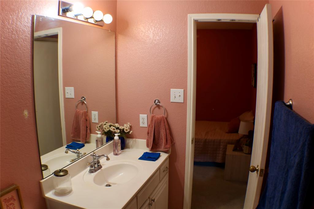 173 West Ranch Lane Weatherford, TX 76088 - Photo 18 of 29 a bathroom with a sink and a mirror