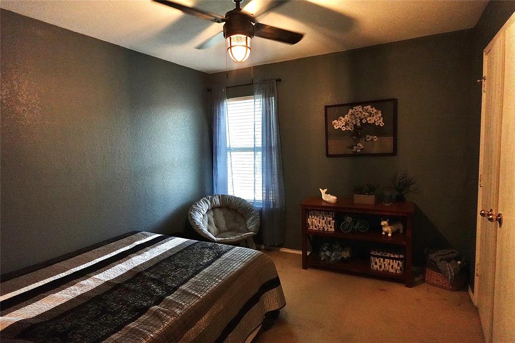 173 West Ranch Lane Weatherford, TX 76088 - Photo 19 of 29 a bedroom with bed and a window