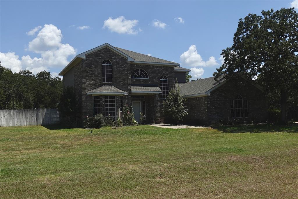 173 West Ranch Lane Weatherford, TX 76088 - Photo 2 of 29 a view of a house with a yard