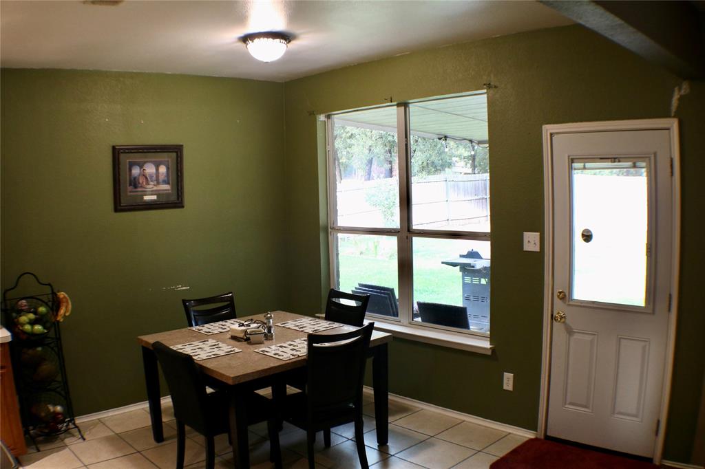 173 West Ranch Lane Weatherford, TX 76088 - Photo 7 of 29 a view of a dining room with a table and chairs