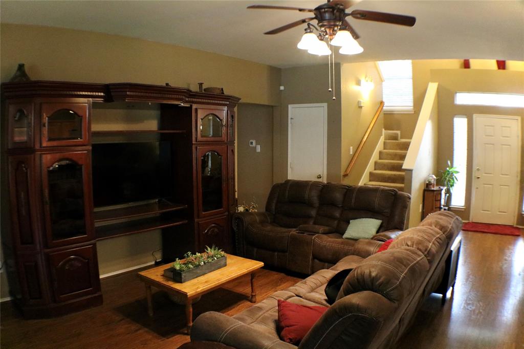 173 West Ranch Lane Weatherford, TX 76088 - Photo 10 of 29 a living room with furniture and a flat screen tv