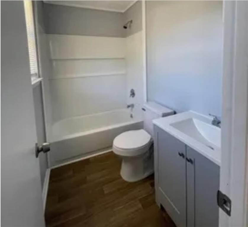 6504 Buffington Road Union City, GA 30291 - Photo 8 of 8 a bathroom with a toilet a sink and bathtub