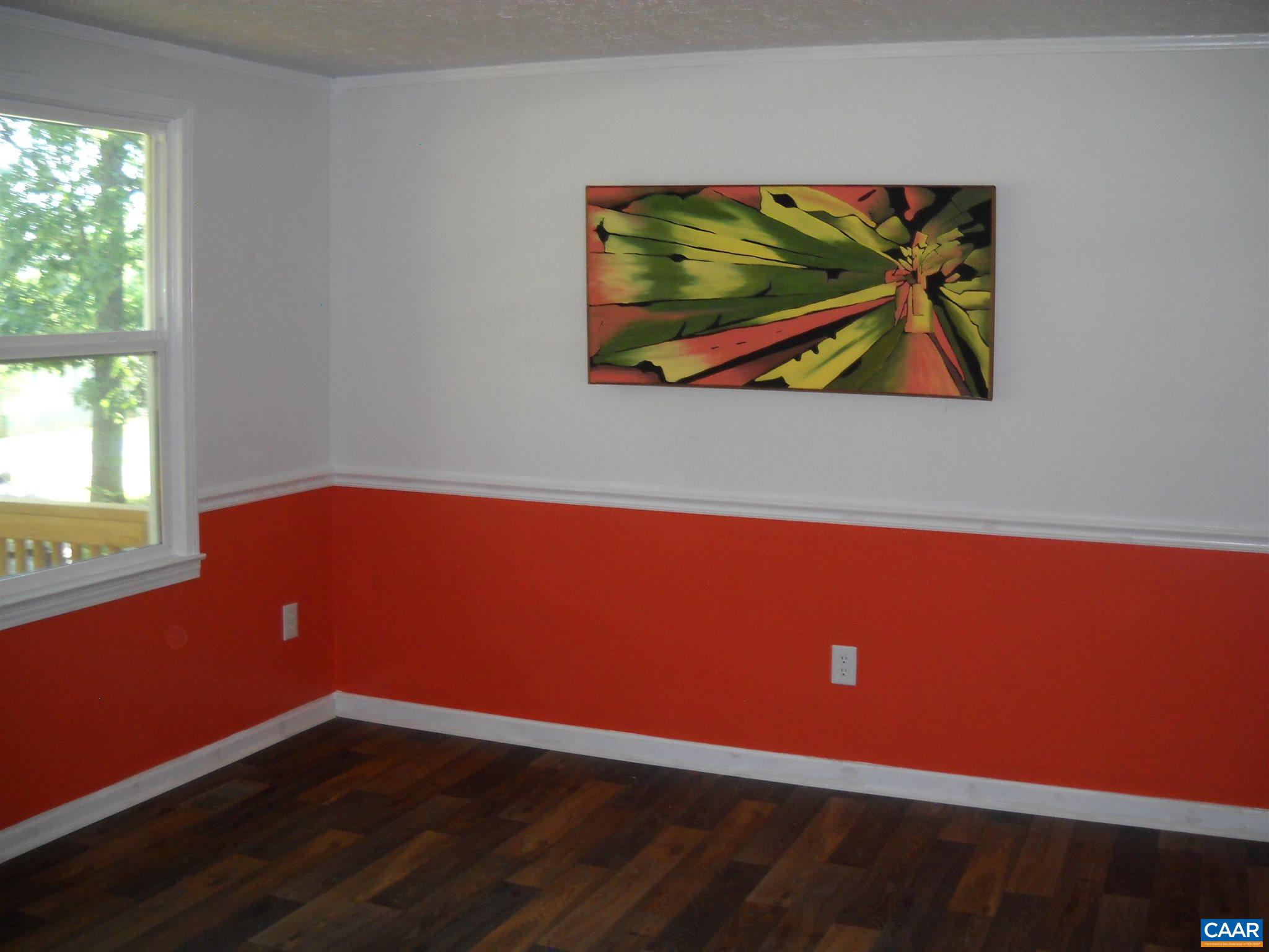 191 Stage Coach Hills Road Palmyra, VA 22963 - Photo 3 of 5 an empty room with wooden floor and window