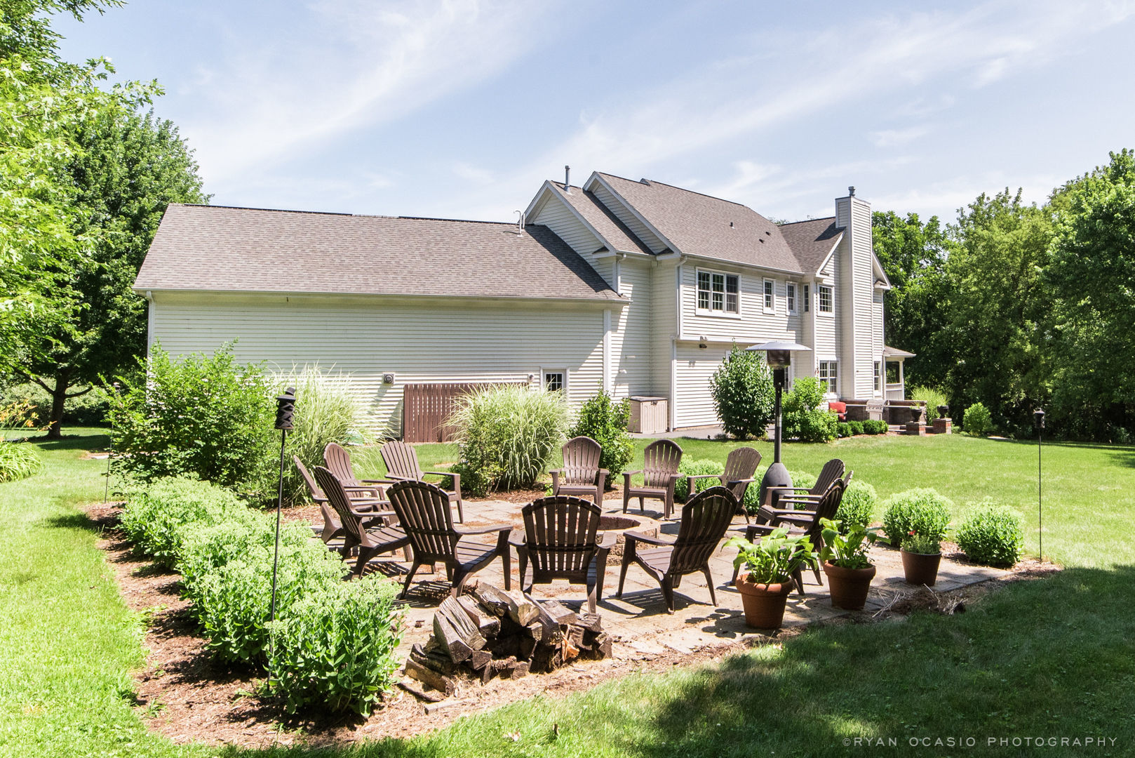 7N607 Stevens Road St. Charles, IL 60175 - Photo 36 of 37 a group of people sitting in a yard with swimming pool