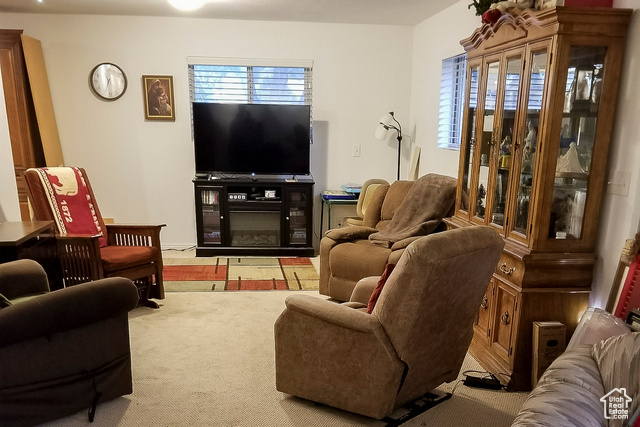 2855 South 1000 West Perry, UT 84302 - Photo 76 of 142 Living area with healthy amount of natural light and light colored carpet