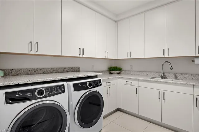 a view of a kitchen with sink and washing machine