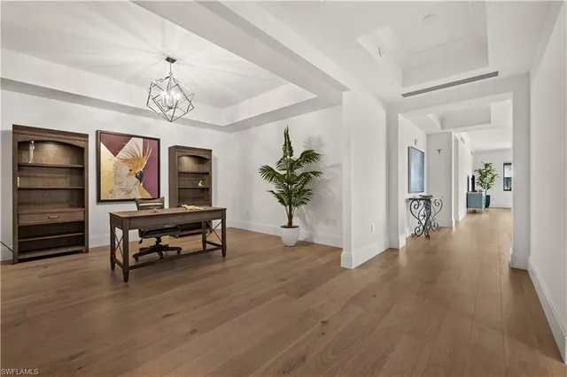 a view of a livingroom with furniture and a chandelier