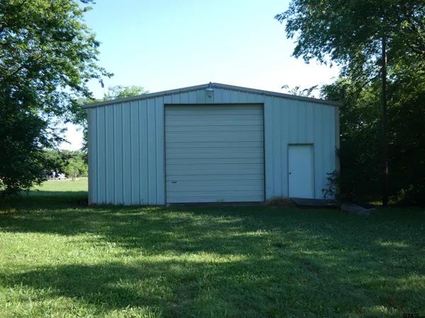 a view of a backyard of the house
