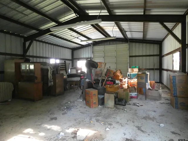a view of a room with wooden ceiling