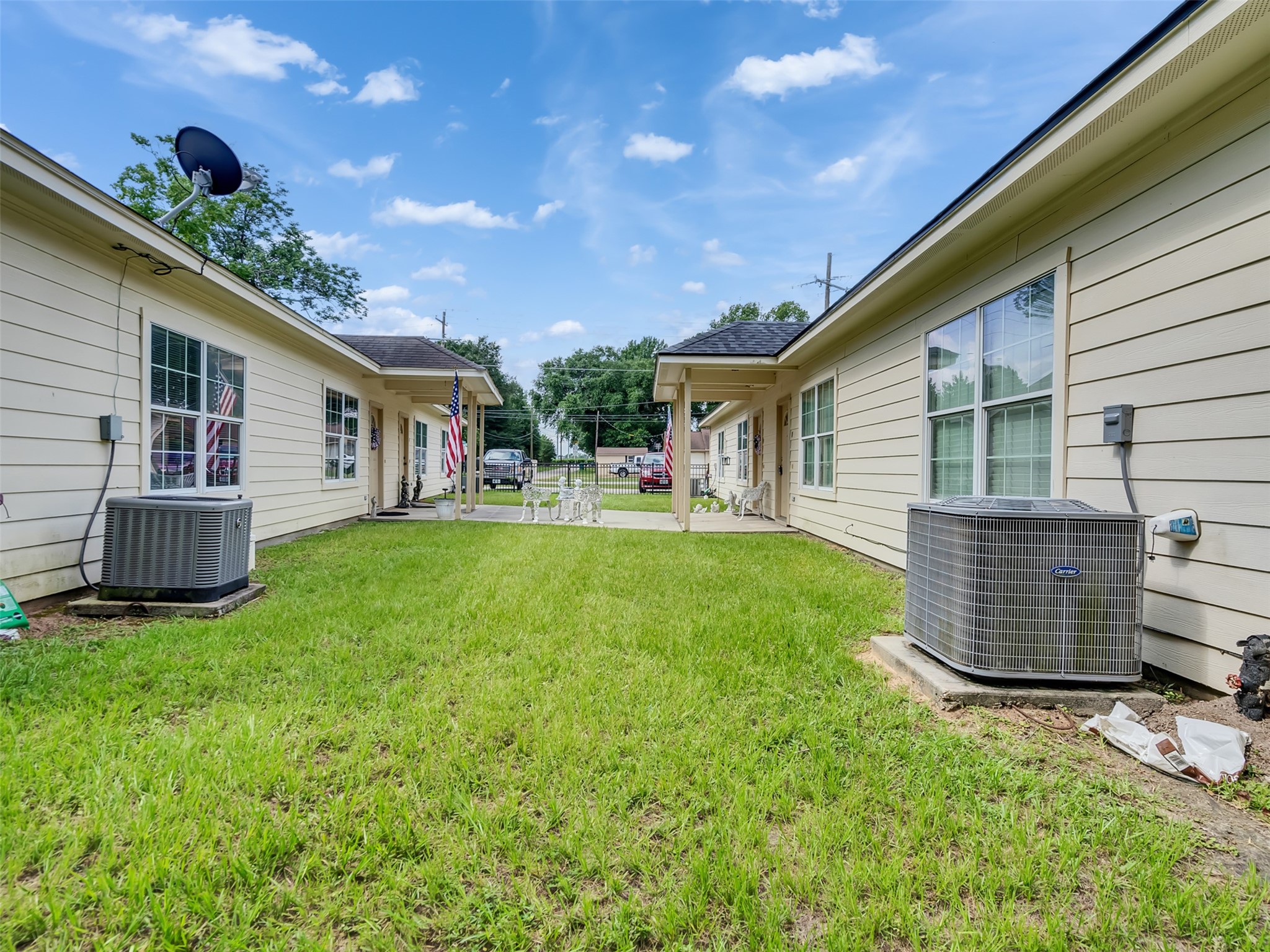 104 Longstreet Road, Unit 2 Willis, TX 77378 - Photo 7 of 26 a backyard of a house with table and chairs