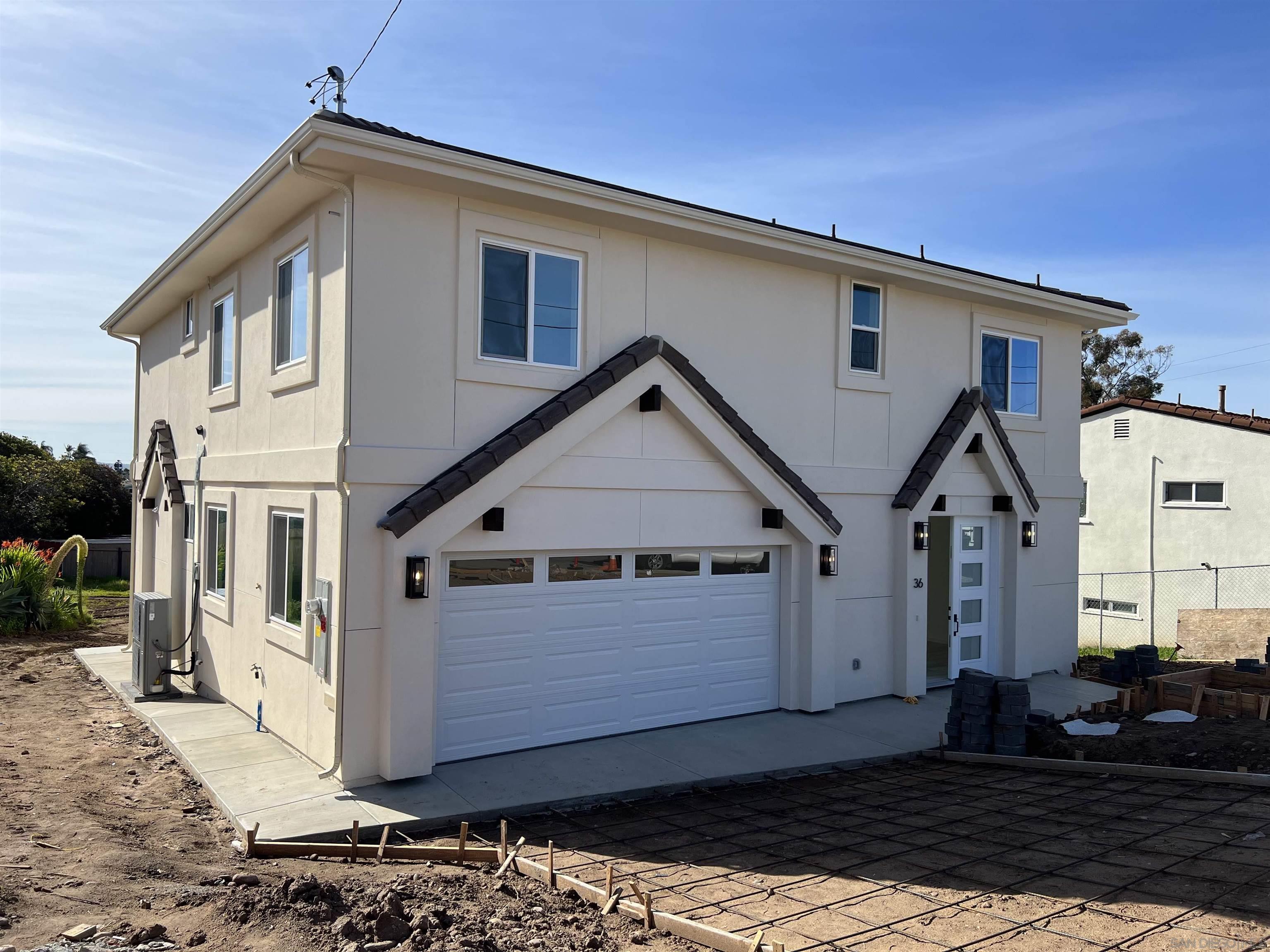 36 L Street Chula Vista, CA 91911 - Photo 1 of 18 a front view of a house with a large window