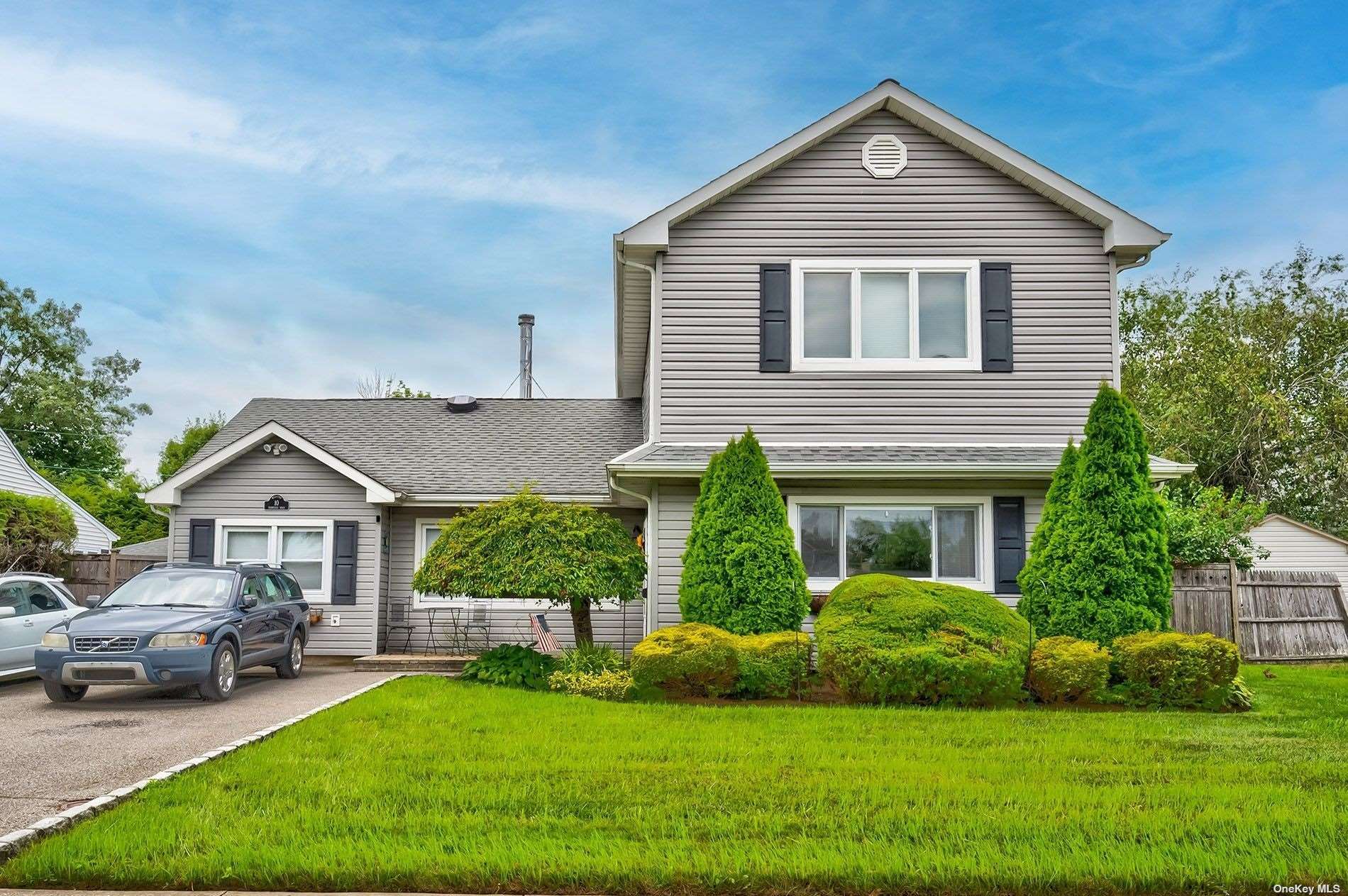 10 Farmedge Road Bethpage, NY 11714 - Photo 1 of 1 a front view of a house with a yard and garage