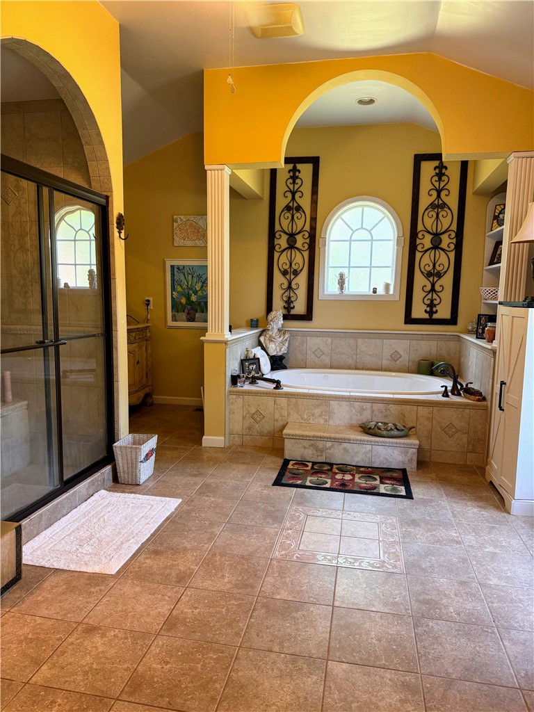208 Knoxwood Court Anderson, SC 29621 - Photo 20 of 38 This primary bathroom features a soaking tub and a spacious walk-in shower.
