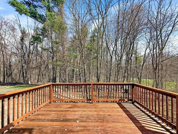a view of balcony with wooden floor