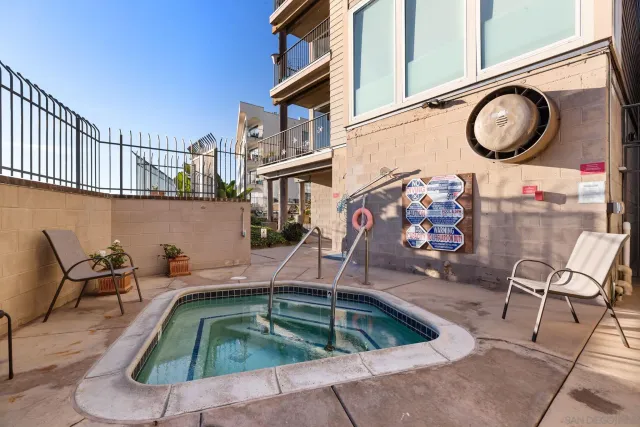 a view of swimming pool with outdoor seating