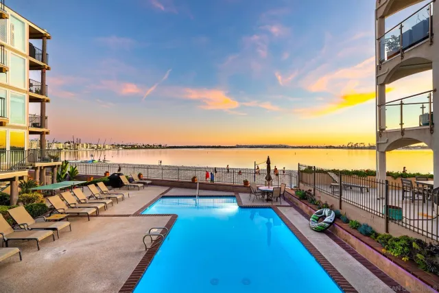 a kitchen with stainless steel appliances a refrigerator and wooden cabinets